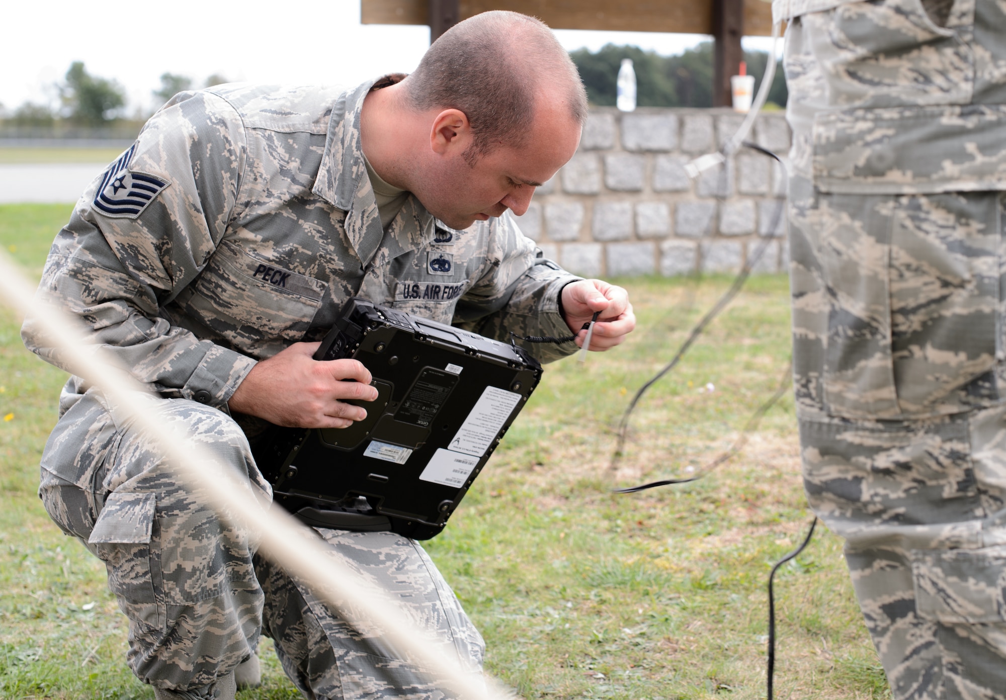 Tech. Sgt. Jacob Peck, 7th Weather Squadron battlefield weather forecaster, secures a computer after a demonstration on operating with limited data in the field and using equipment to improve weather forecasting Sept. 16, 2015, at Grafenwohr Training Area, Germany. The instructors of the 7th WS used a variety of tools including briefing and hands-on lessons to develop 30 battlefield weather airmen during the annual Cadre Focus training exercise. The 7th WS revamped Cadre Focus to concentrate on basic field training skills and forecasting in Eastern Europe. The squadron is the only one embedded alongside Army units providing weather intelligence throughout the European and African areas of operation. (U.S. Air Force photo/Staff Sgt. Armando A. Schwier-Morales)