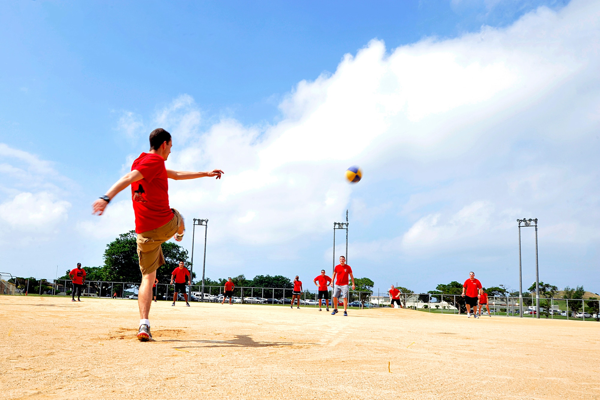 Members from the 909th Air Refueling Squadron play kickball together as part of Wingman Day Oct. 2, 2015, on Kadena Air Base, Japan. Wingman Day gave Airmen the chance to focus on mental, spiritual, social, and fitness resiliency and provided an opportunity for the Airmen to learn more about each other and themselves. (U.S. Air Force photo by Naoto Anazawa)