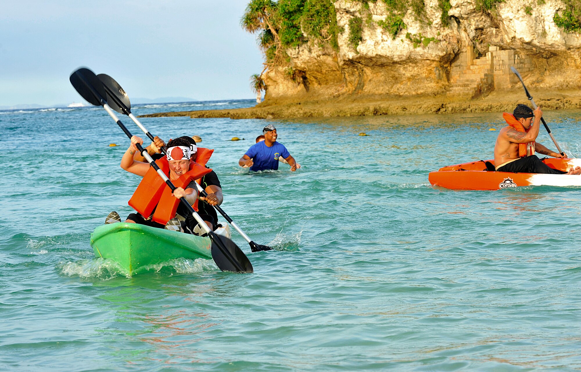 Airmen from the 18th Force Support Squadron race canoes during Wingman Day Oct. 2, 2015, at the Kadena Marina. Wingman Day is designed to improve the resiliency of individuals through structured discussion in small groups and team-building exercises. (U.S. Air Force photo by Naoto Anazawa)