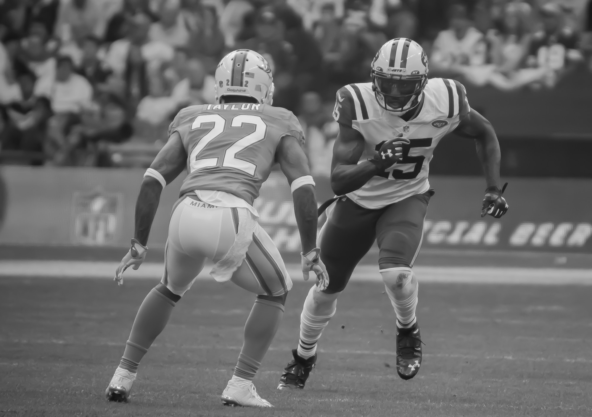 Brandon Marshall (15), New York Jets wide receiver, runs a passing route against Jamar Taylor (22), Miami Dolphins cornerback, during the 2nd quarter of the game at Wembley Stadium in London on Oct. 4, 2015. Marshall said that it was one of the best games, as far as the environment goes, that he’s ever played in. (U.S. Air Force photo/ Senior Airman Trevor T. McBride/Released)
