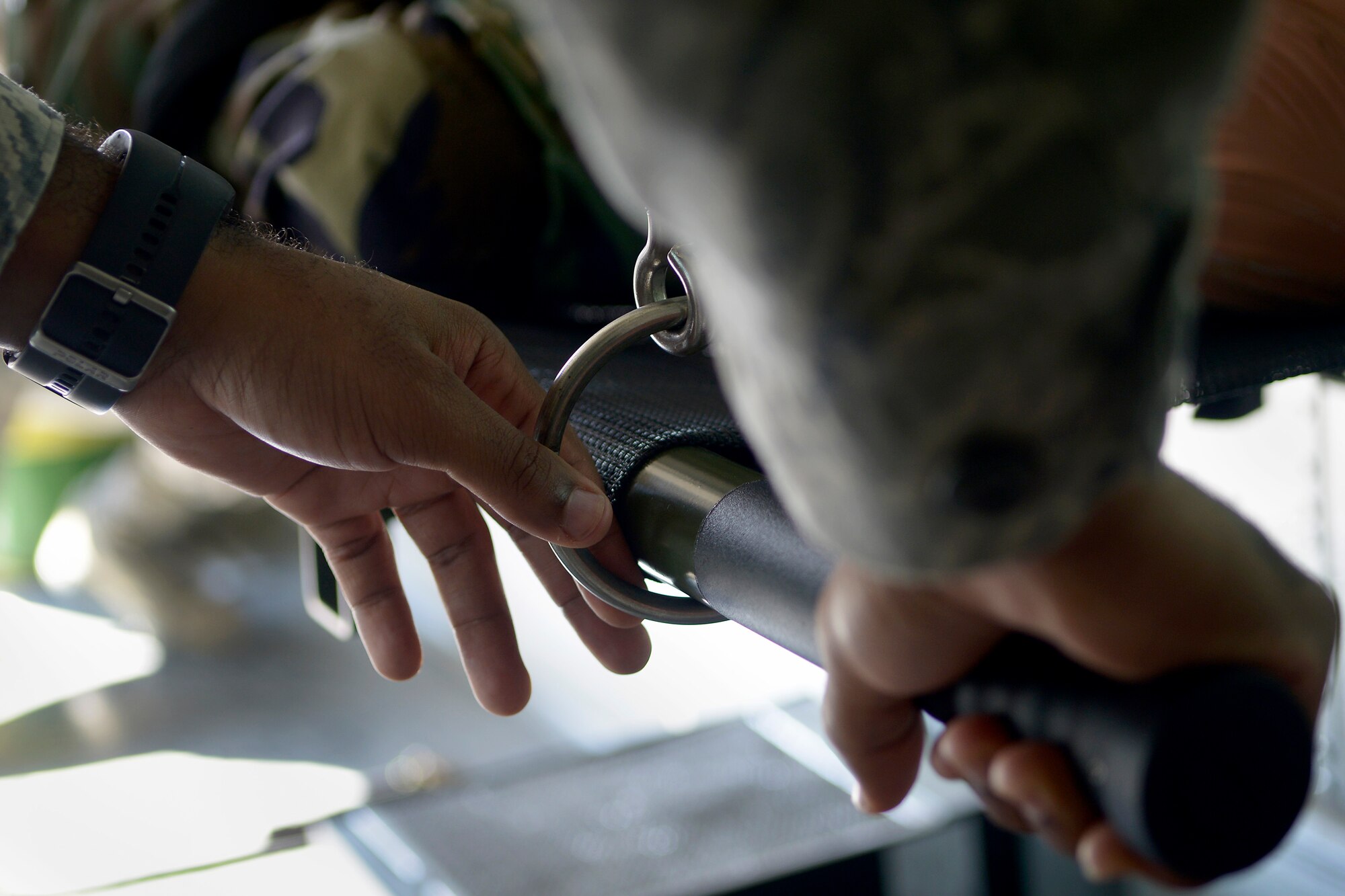 An Airman from the 39th Medical Operations Squadron secures a litter in place aboard an ambulance bus during a training session Sept. 30, 2015, at Incirlik Air Base, Turkey. Airmen from the 39th Medical Group gathered for a 4-hour training session to develop their skills on multiple work-center specific competencies. (U.S. Air Force photo by Senior Airman Krystal Ardrey)