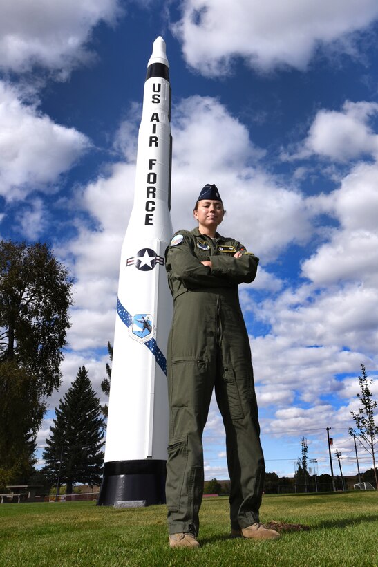 Air Force 2nd Lt. Angie Phillips, 490th Missile Squadron deputy missile combat crew commander, stands in front a Minuteman I missile Sept. 18, 2015, in Lewistown, Mont. Phillips and a handful of volunteers from Malmstrom Air Force Base, Mont., and the local community restored the Minuteman I missile back to its former glory. U.S. Air Force photo by Chris Willis