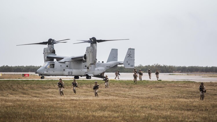 U.S. and Spanish Marines establish a combined security perimeter during an interoperability demonstration to U.S. Secretary of Defense Ashton Carter, Oct. 6, 2015, at Morón Air Base, Spain. Carter emphasized the importance of working with partner nations and to continue fostering relationships through such training exercises. 