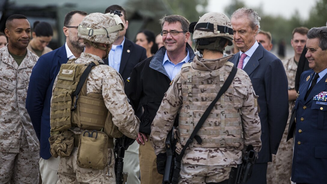 U.S. and Spanish Marines talk about their close relationships with U.S. Secretary of Defense Ashton Carter (center) and Spanish Minister of Defense, Pedro Morenés Eulate (right),  Oct. 6, 2015 at Morón Air Base, Spain. During the visit, Carter emphasized the value of our longstanding friendship and alliance with Spain. 