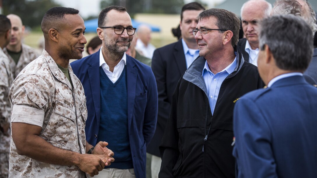 Col. Calvert Worth, the Special-Purpose Marine Air-Ground Task Force Crisis Response-Africa commander (left), talks with James Costos, U.S. Ambassador to Spain (center), and Ashton Carter, U.S. Secretary of Defense, Oct. 6, 2015, at Morón Air Base, Spain. During the visit, Carter observed U.S. and Spanish Marines work together during capability demonstration highlighting U.S. and Spanish defense partnerships.  