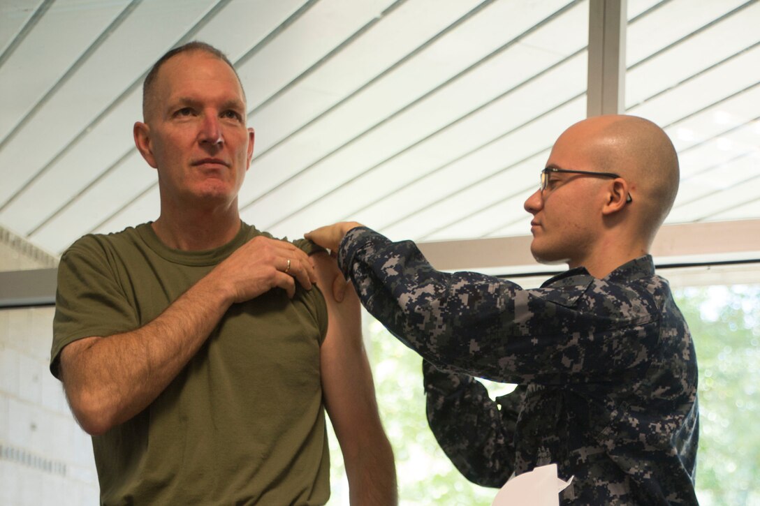 Lt. Gen. Mark A. Brilakis, Commanding General, Marine Corps Recruiting Command, leads from the top and gets his required annual flu shot aboard Marine Corps Base Quantico, Oct. 6. The flu is a serious illness that can lead to hospitalization and death. Flu season lasts from October through May. 