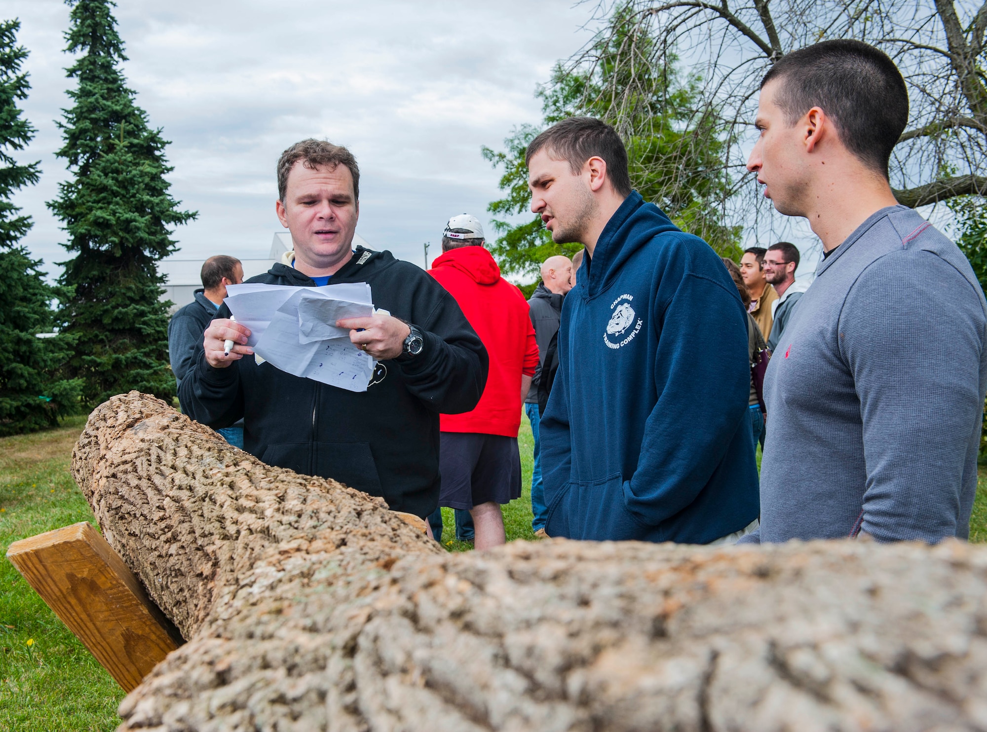 WRIGHT PATTERSON AIR FORCE BASE, Ohio -- Members of the National Air and Space Intelligence Center, prepare for the log saw competition during the center's 47th Annual Oktoberfest celebration at Bass Lake, Oct. 6, 2015. During the celebration different units within the center compete in the Oktoberfest games while enjoying traditional German cuisine. (U.S. Air Force photo by Tech. Sgt. Eunique P. Thomas)