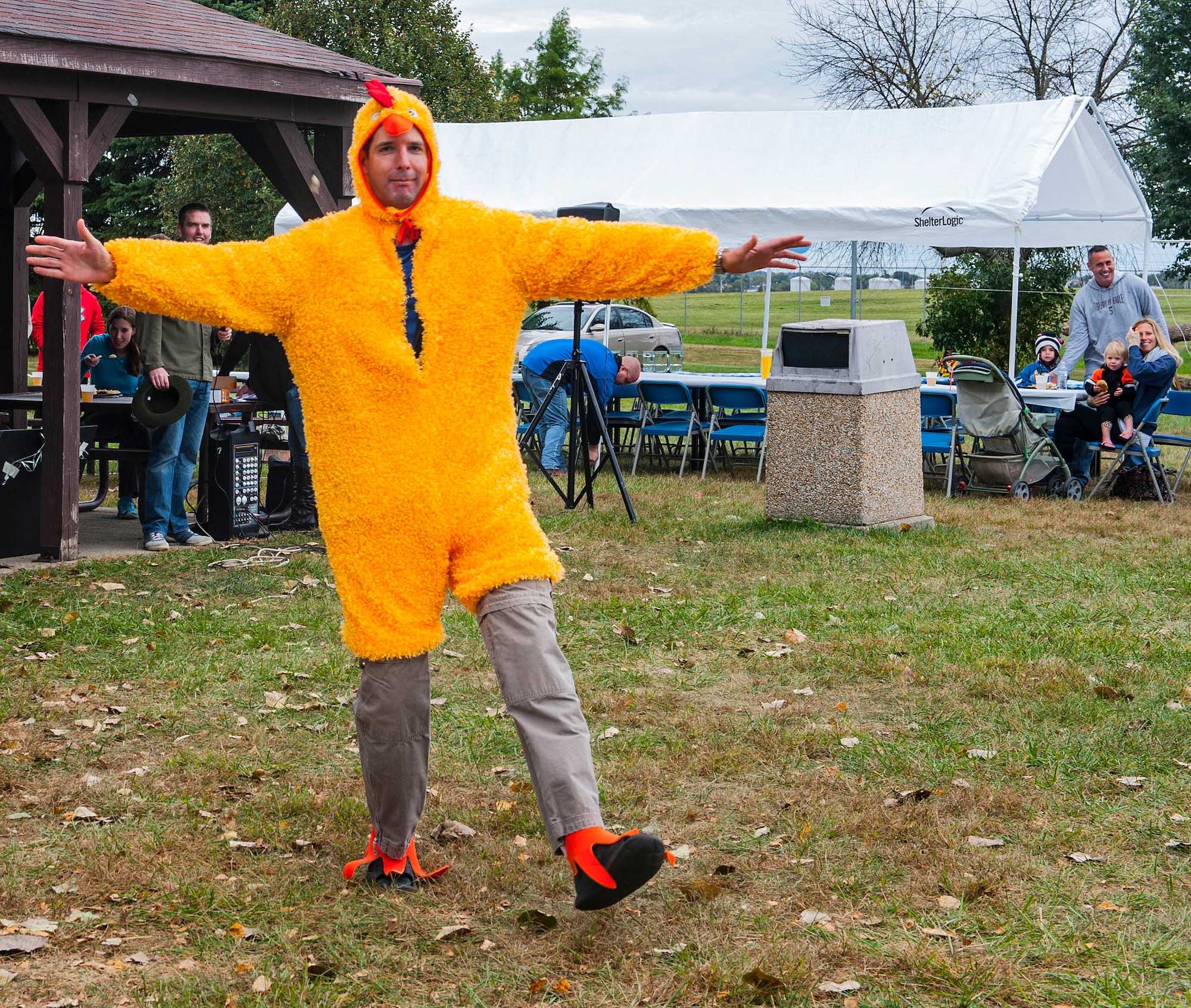 WRIGHT PATTERSON AIR FORCE BASE, Ohio -- Maj. Christopher Wood, National Air and Space Intelligence Center, dances in a chicken suit during the center's 47th Annual Oktoberfest celebration at Bass Lake, Oct. 6, 2015. During the celebration different units within the center compete in the Oktoberfest games while enjoying traditional German cuisine. (U.S. Air Force photo by Tech. Sgt. Eunique P. Thomas)