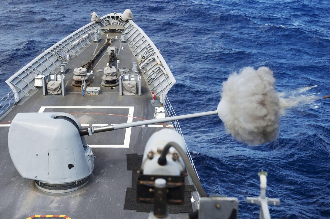The USS Chancellorsville fires its MK 45 5-inch gun during a live-fire gunnery exercise in waters south of Japan, Sept. 30, 2015. The Chancellorsville is on patrol in the U.S. 7th Fleet area of responsibility in support of security and stability in the Asia-Pacific region. U.S. Navy photo by Petty Officer 2nd Class Raymond D. Diaz III