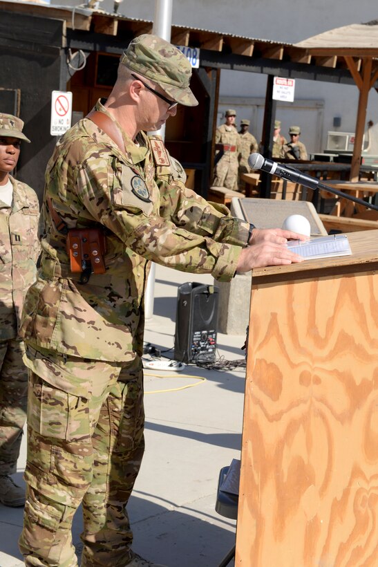 U.S. Air Force Lt. Col. Mitchell Spillers speaks at a memorial ceremony for six fallen U.S. airmen on Bagram Airfield, Afghanistan, Oct. 3, 2015. Spillers is commander of the 774th Expeditionary Airlift Squadron. U.S. Air Force photo by Senior Airman Cierra Presentado