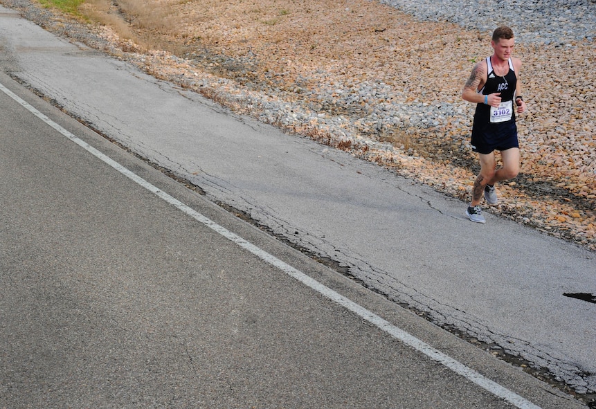 A marathon participant runs the 19th Annual U.S. Air Force Marathon, Sept. 19, 2015, near Wright-Patterson Air Force Base, Ohio. Thousands of runners and cclists from across the country attended the three-day event that began Sept. 17 and included a Sport and Fitness Expo, Gourmet Pasta Dinner and a full, and half marathon, 10K, and 5K race. (U.S. Air Force photo by Senior Airman Matthew Lotz)