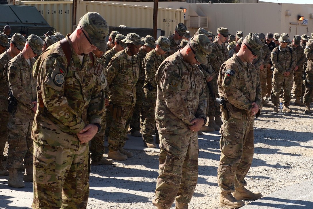 U.S. Air Force Brig. Gen. Dave Julazadeh, center, commander of the 455th Air Expeditionary Wing, U.S. Air Force Lt. Col. Mitchell Spillers, left, U.S. Air Force Maj. Met Berisha, right, and other airmen gather to pay respect and mourn the loss of six U.S. fallen airmen during a memorial ceremony on Bagram Airfield, Afghanistan, Oct. 3, 2015. Spillers is commander of the 774th Expeditionary Airlift Squadron and Berisha is commander of the 455th Expeditionary Security Forces Squadron. U.S. Air Force photo by Senior Airman Cierra Presentado