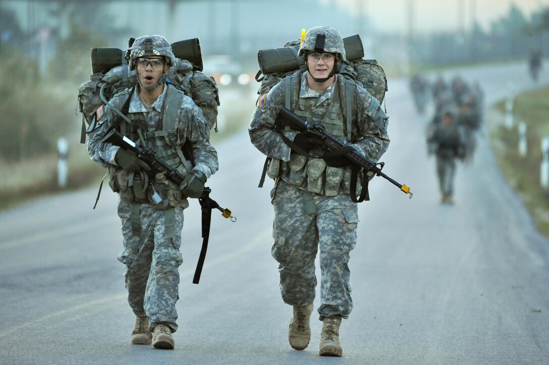 U.S. soldiers conduct a 12-mile march during the Joint Multinational Readiness Center’s Expert Infantryman Badge Competition in Bavaria, Germany, Oct. 2, 2015. The soldiers are assigned to the 7th Army Joint Multinational Training Command. U.S. Army photo by Visual Information Specialist Gertrud Zach
