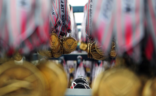 Medals await their runners at the finish line during the 19th Annual U.S. Air Force Marathon Saturday, Sept. 19, 2014, on Wright-Patterson Air Force Base, Ohio. The marathon maxed out its entries with 15,000 competitors racing in the 10-kilometer, half marathon, and full marathon; along with more than 2,000 service members running in deployed locations around the world. The first Air Force Marathon took place in 1997 and had 2,600 racers. (U.S. Air Force photo by Tech. Sgt. Raymond Hoy)
