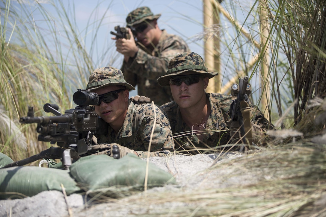 U.S. Marines sight in during platoon movement at Crow Valley, Philippines, Oct. 2, 2015, as part of Amphibious Landing Exercise 2015. The Marines are assigned to Echo Company, 2nd Battalion, 5th Marine Regiment. U.S. Marine Corps photo by Lance Cpl. Juan Bustos