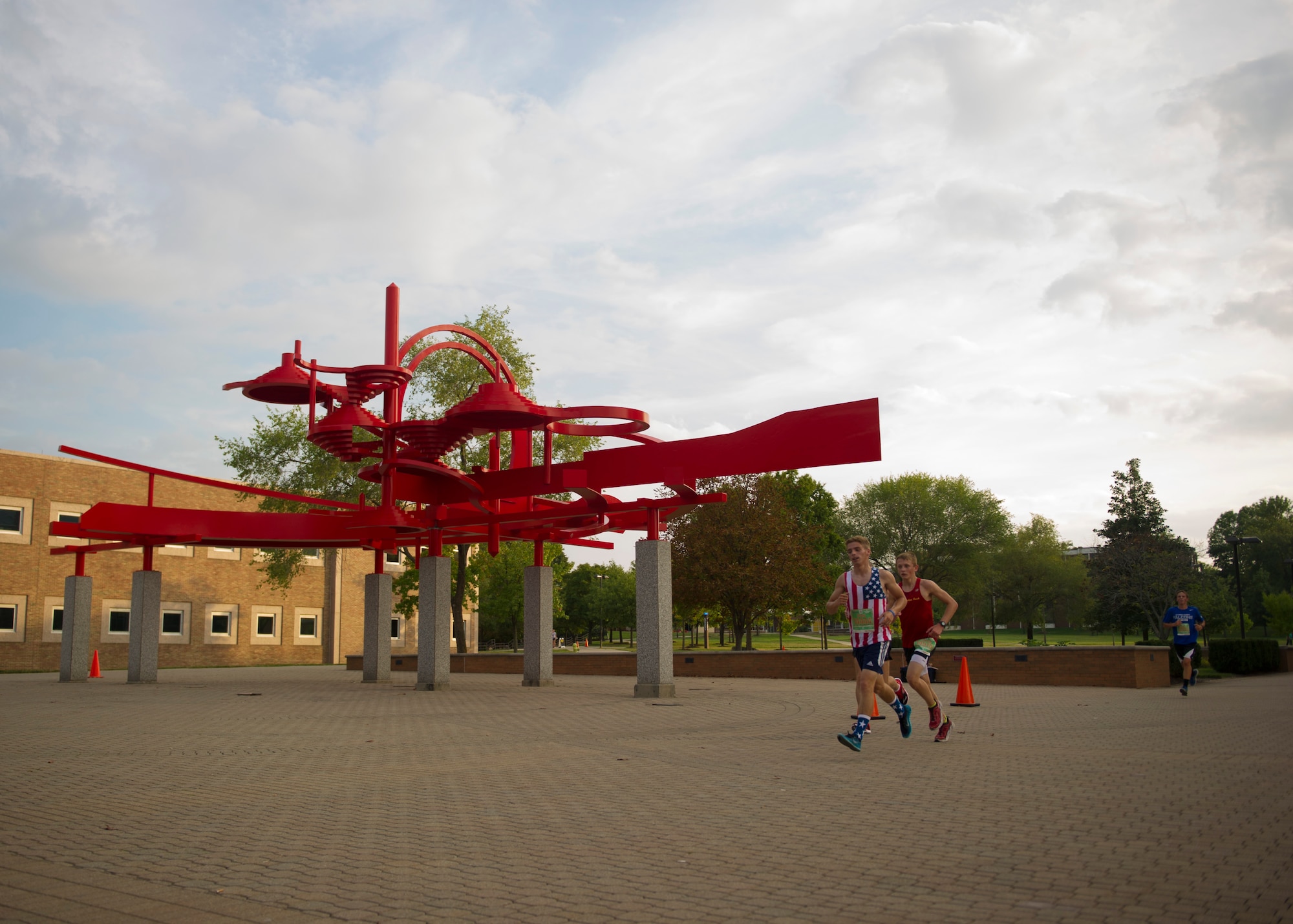 U.S. Air Force 5K participants make their way toward the finish line on Wright State University, Ohio, Sept. 18, 2015. The marathon maxed out its entries with 15,000 competitors racing in the 10-kilometer, half marathon, and full marathon; along with more than 2,000 service members running in deployed locations around the world. The first Air Force Marathon took place in 1997 and had 2,600 racers. (U.S. Air Force photo by Senior Airman Justyn M. Freeman)