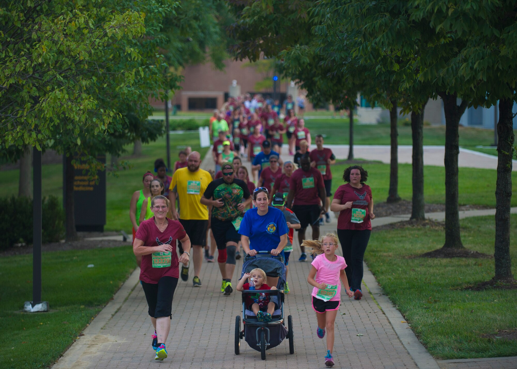 U.S. Air Force 5K participants make their way toward the finish line on Wright State University, Ohio, Sept 18, 2015. The marathon maxed out its entries with 15,000 competitors racing in the 10-kilometer, half marathon, and full marathon; along with more than 2,000 service members running in deployed locations around the world. The first Air Force Marathon took place in 1997 and had 2,600 racers. (U.S. Air Force photo by Senior Airman Justyn M. Freeman)