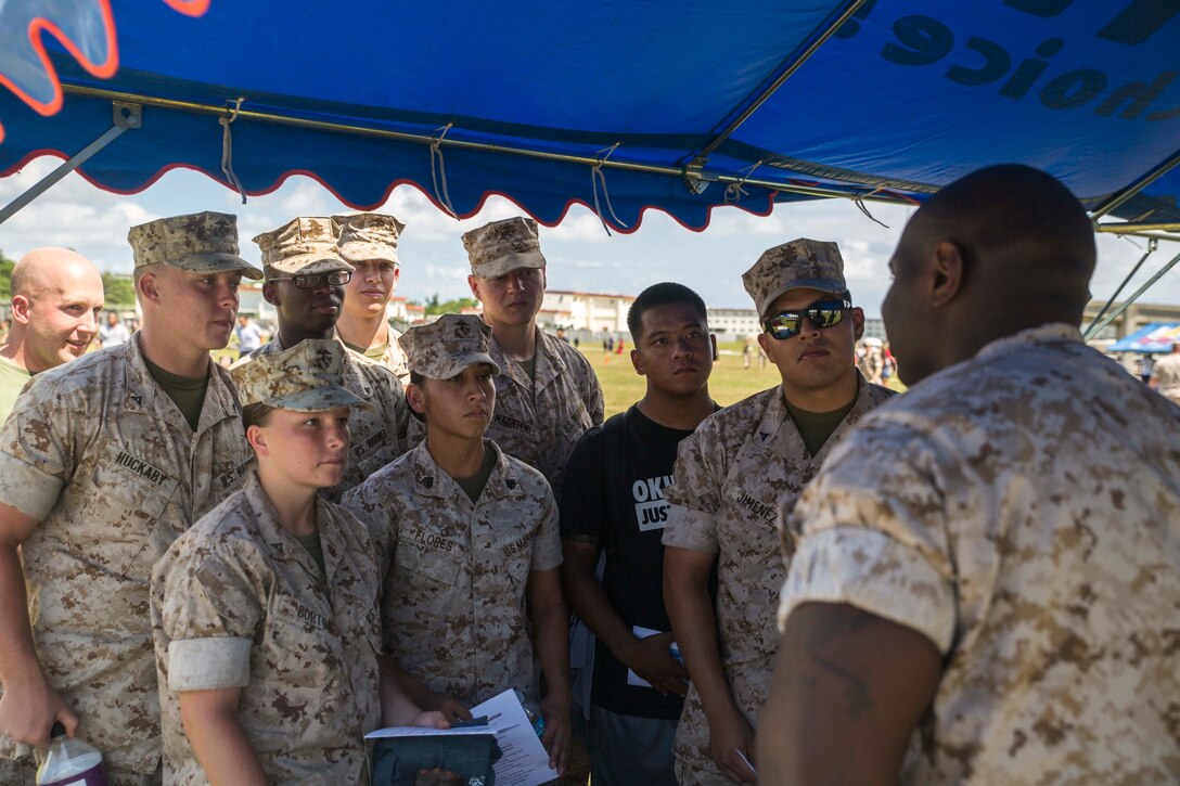 Navy Petty Officer 2nd Class Edward Jones teaches Marines about the Outpatient Crisis Prevention Program during the Warrior Tournament at Camp Hansen, Okinawa, Japan, Sept. 25, 2015. The program is a five-day psycho-educational training course designed to enhance coping skills and interpersonal effectiveness of active duty personnel suffering from severe anxiety and depression. According to Jones, the mission of the program is to strengthen the resilience and readiness of participants in coping with personal and professional challenges. Jones, from Grand Rapids, Michigan, is an OSCAR Team corpsman with Headquarters Battalion, 3rd Marine Division, III Marine Expeditionary Force. 