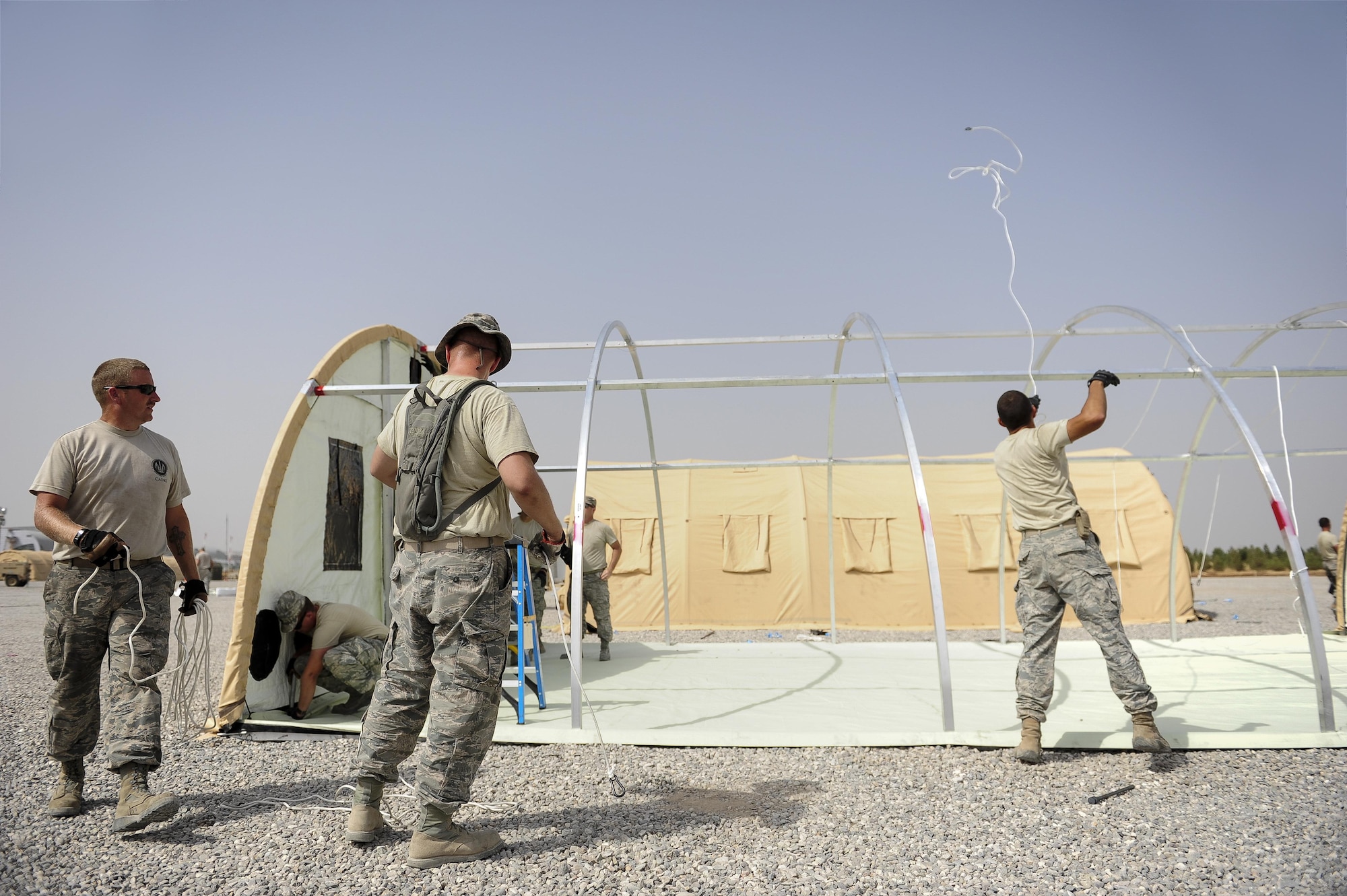 Airmen from the 435th Contingency Response Squadron prepare shelters Sept. 13, 2015, in support of the U.S. Air Force’s personnel recovery mission at Diyarbakir Air Base, Turkey. The 435th CRG mobilizes and deploys advanced combat-ready tactical forces, communications equipment and airfield systems for wartime and contingency operations. The deployment of assets and personnel will enable the Air Force to better assist with recovery of coalition partners, should they need assistance in Syria or Iraq. (U.S. Air Force photo/Airman Cory W. Bush)