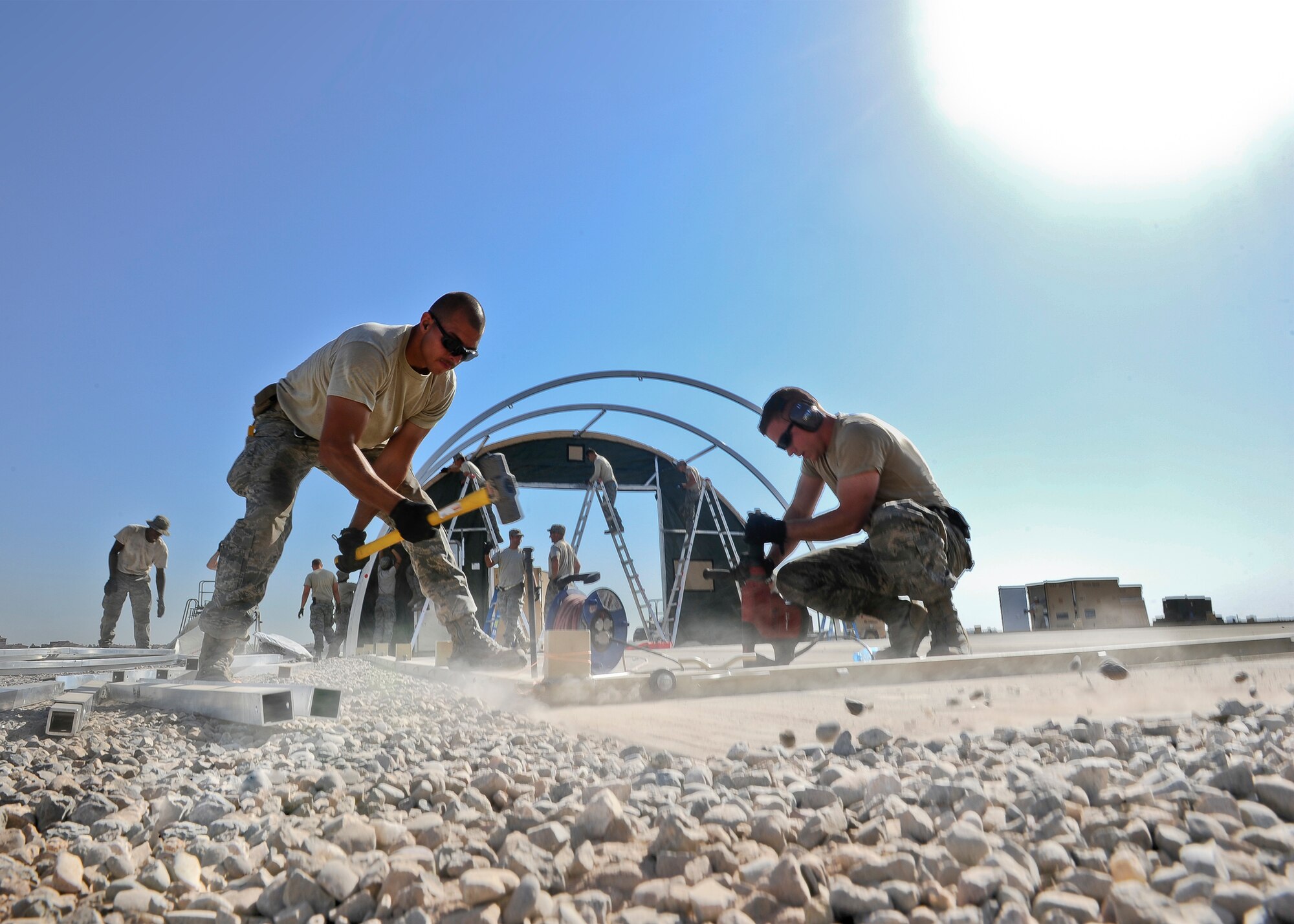 Staff Sgt. Adam Borjon, a 435th Construction Training Squadron engineer system’s operator, and Senior Airman Alen Turner, a 435th CTS pavement and equipment operator, build structures Sept. 23, 2015, in support of personnel recovery operations at Diyarbakir Air Base, Turkey. The 435th Contingency Response Group deployed from Ramstein Air Base, Germany, in support of the U.S. Air Forces Central Command’s staging aircraft and Airmen in southeast Turkey to enhance coalition capabilities to support personnel recovery operations in Syria and Iraq. (U.S. Air Force photo/Airman Cory W. Bush)