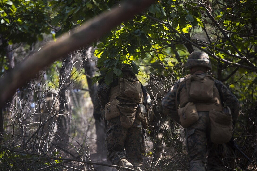 U.S. Marines storm a hill to prepare for a full battalion-scale assault exercise during Korean Marine Exchange Program 15-12 at Rodriguez Landing Zone, Republic of Korea, Sept. 25, 2015. KMEP 15-12 is a bilateral training exercise that enhances the ROK and U.S. alliance, promotes stability on the Korean Peninsula and strengthens ROK and U.S. military capabilities and interoperability. The Marines are with Fox Company, 2nd Battalion, 3rd Marine Regiment, currently assigned to 4th Marine Regiment, 3rd Marine Division, III Marine Expeditionary Force under the unit deployment program.
