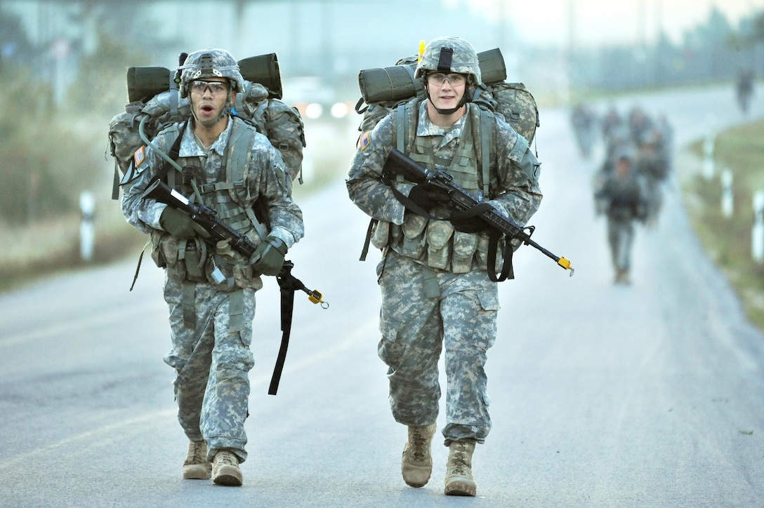 U.S. soldiers conduct a 12-mile march during the Joint Multinational Readiness Center’s Expert Infantryman Badge Competition in Bavaria, Germany, Oct. 2, 2015. The soldiers are assigned to the 7th Army Joint Multinational Training Command. U.S. Army photo by Gertrud Zach