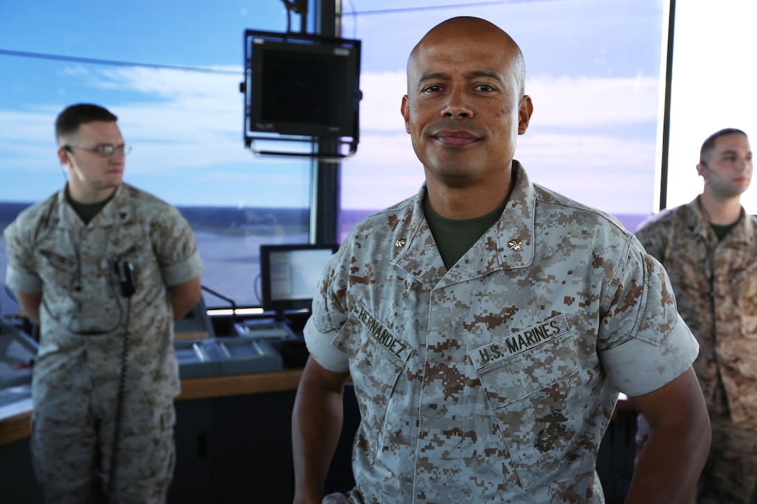 Maj. Jose R. Hernandez poses for a photograph in an observance and control room of the air traffic control tower at Marine Corps Air Station Cherry Point, North Carolina, Oct. 7, 2015. The Marine Corps is made up of people from various backgrounds and locations who have found the honor, courage and commitment to uphold the traditions of a 239-year-old community. The Corps’ diverseness holds no prejudice for the men and women who are willing to pay the ultimate price to defend their nation. Hernandez is a proud member of the Hispanic community and an example of Hispanic Heritage Month being celebrated and Hispanic-Americans serving at the air station. Hernandez is an air traffic control officer with Headquarters and Headquarters Squadron. 
