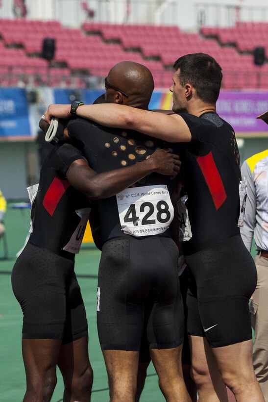 U.S. track athletes hug after the Men’s 4x400-meter relay race during the 6th Military World Games in Mungyeong, South Korea, Oct. 7, 2015. U.S. Marine Corps photo by Sgt. Ashley N.Cano