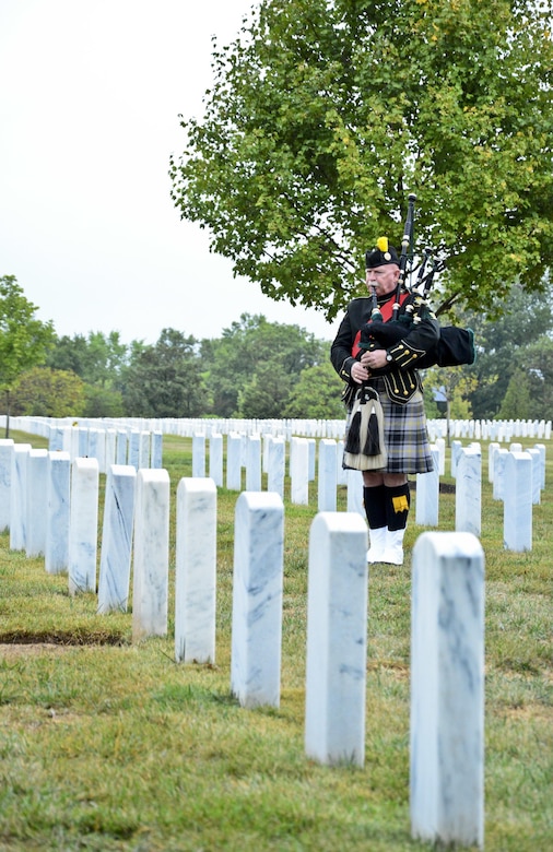 Kevin Donnelly plays the bagpipe at Arlington National Cemetery for the Military Police Corps Regimental Remembrance Ceremony held Sept. 30.  Guests pay special tribute to the Military Police who sacrificed their lives while serving during the last year. (U.S. Army photo taken by Sgt. Elizabeth Taylor/Released)