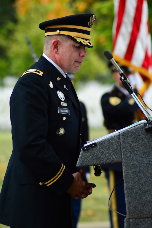 Col. Kenneth R. Williams, Pentagon chaplain, prays at Arlington National Cemetery for the Military Police Corps Regimental Remembrance Ceremony held Sept. 30.  Guest pay special tribute to the Military Police who sacrificed their lives while serving during the last year. (U.S. Army photo taken by Sgt.  Elizabeth Taylor/Released)