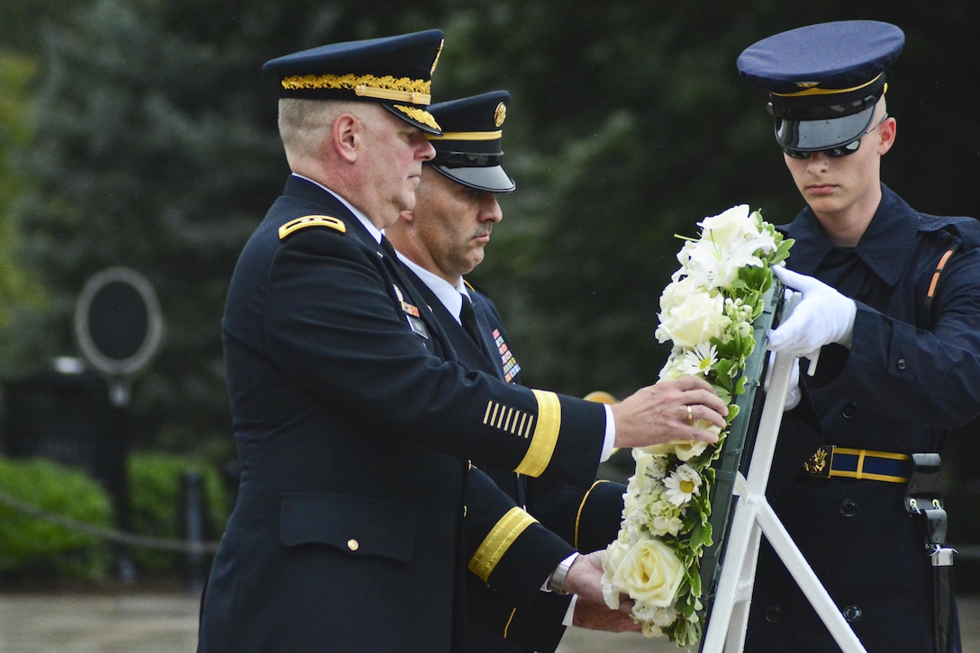 Maj. Gen. Mark S. Inch, the provost marshal general of the Army and Sgt. Maj. Timothy Fitzgerald, the provost marshal general sergeant major place a wreath at Arlington National Cemetery for the Military Police Corps Regimental Remembrance Ceremony held Sept. 30. Guests pay special tribute to the Military Police who sacrificed their lives while serving during the last year. 
(U.S. Army photo taken by Sgt. Elizabeth Taylor/released)