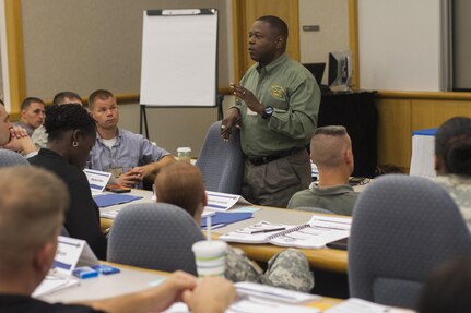 Maj. Gen. Phillip M. Churn. the commanding general for the 200th Military Police Command, briefs the command teams at the Family Readiness Training event in Shepherdstown, W.Va., about his expectations for the unit Family Readiness groups moving forward, Sept. 19.  The event provided participants with the tools necessary to successfully  develop a Family Readiness Group.