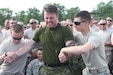 U.S. Army Reserve, and Canadian soldiers volunteer to feel the effects of the Taser after completing the practical portion of the Taser training during Operation Guardian Justice in Fort McCoy, Wis., June 10,2015. (U.S. Army Reserve Photo by Spc. Stephanie Ramirez/Released)