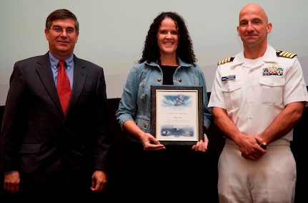 DAHLGREN, Va. - Janette Calo receives her certificate of achievement from Naval Surface Warfare Center Dahlgren Division (NSWCDD) Technical Director Dennis McLaughlin and NSWCDD Commanding Officer Capt. Brian Durant at the annual command academic awards ceremony, Sept. 21. The NSWCDD engineer - and her husband, Mike McDonald - were recognized for completing a master's degree in systems engineering  and commended for commitment to their personal and professional development. 