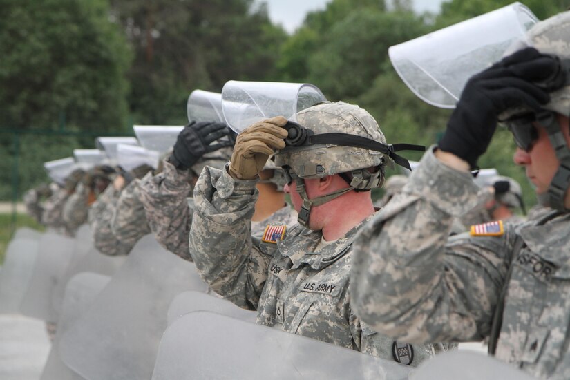 U.S. Soldiers from the 1st Battalion, 252nd Armor Regiment, perform commands given during crowd and riot control training June 15 at the Joint Multinational Readiness Center in Hohenfels, Germany. The training is being conducted in preparation for a peacekeeping mission in Kosovo.