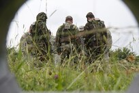The 666th EOD Company from Jacksonville, Ala., performs various training techniques with the Moldovan army in the counter improvised explosive device training area June 21 at the Joint Multinational Readiness Training Center in Hohenfels, Germany. The purpose of the training is to make sure all EOD techs sharpen their individual skills as they prepare for real-world missions in Kosovo. One of the techniques used is designed so the techs can limit the contact involved when dealing with an explosive device. (U.S. Army Photo by Sgt. Erick Yates)