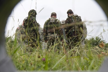 The 666th EOD Company from Jacksonville, Ala., performs various training techniques with the Moldovan army in the counter improvised explosive device training area June 21 at the Joint Multinational Readiness Training Center in Hohenfels, Germany. The purpose of the training is to make sure all EOD techs sharpen their individual skills as they prepare for real-world missions in Kosovo. One of the techniques used is designed so the techs can limit the contact involved when dealing with an explosive device. (U.S. Army Photo by Sgt. Erick Yates)