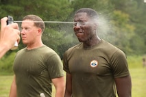 A Marine with 1st Battalion, 8th Marine regiment begins the non-lethal instructor course by being sprayed with Oleoresin Capsicum (OC) spray at Camp Lejeune, N.C., Sept. 30, 2015. Although being temporarily blind from the OC spray the Marines are still required to finish this course in less than four minutes. 