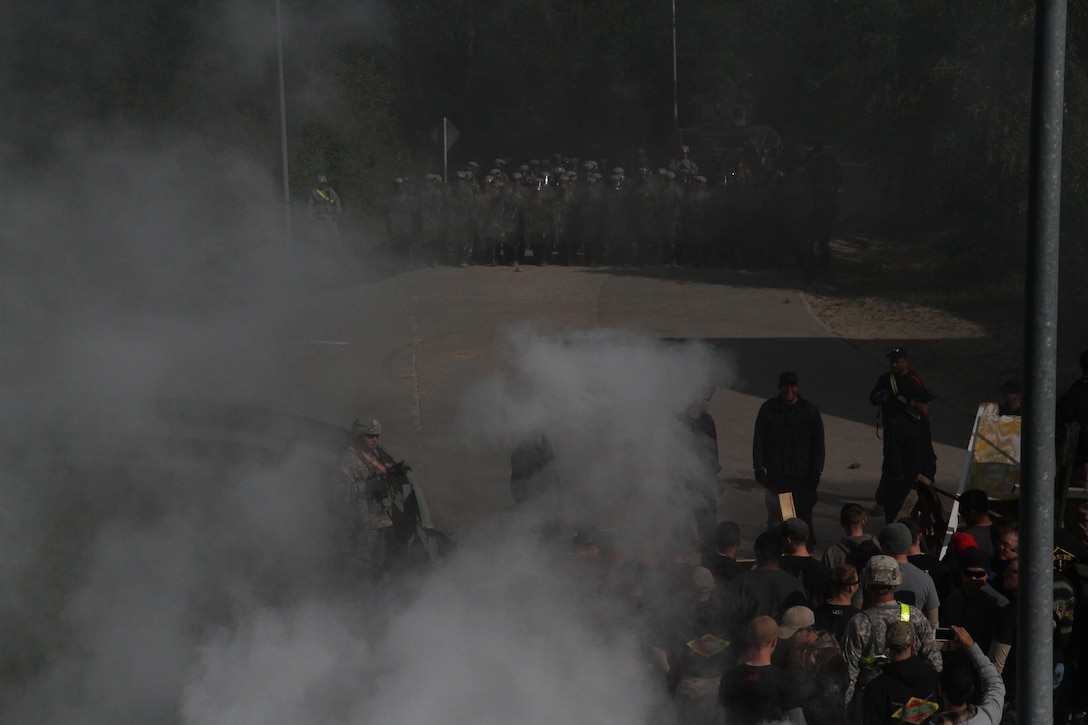 Soldiers from 1st Battalion, 252nd Armor Regiment’s Alpha Company take part in a multinational exercise that included forces from the U.S., Albania and Moldova for crowd and riot control June 25 in Hohenfels, Germany. Serving under the 30th Armored Brigade Combat Team, an Army National Guard Unit from North Carolina, the 1/252 AR participated in this training event in preparation for a peacekeeping mission in Kosovo. (U.S. Army Photo by Sgt. Erick Yates)