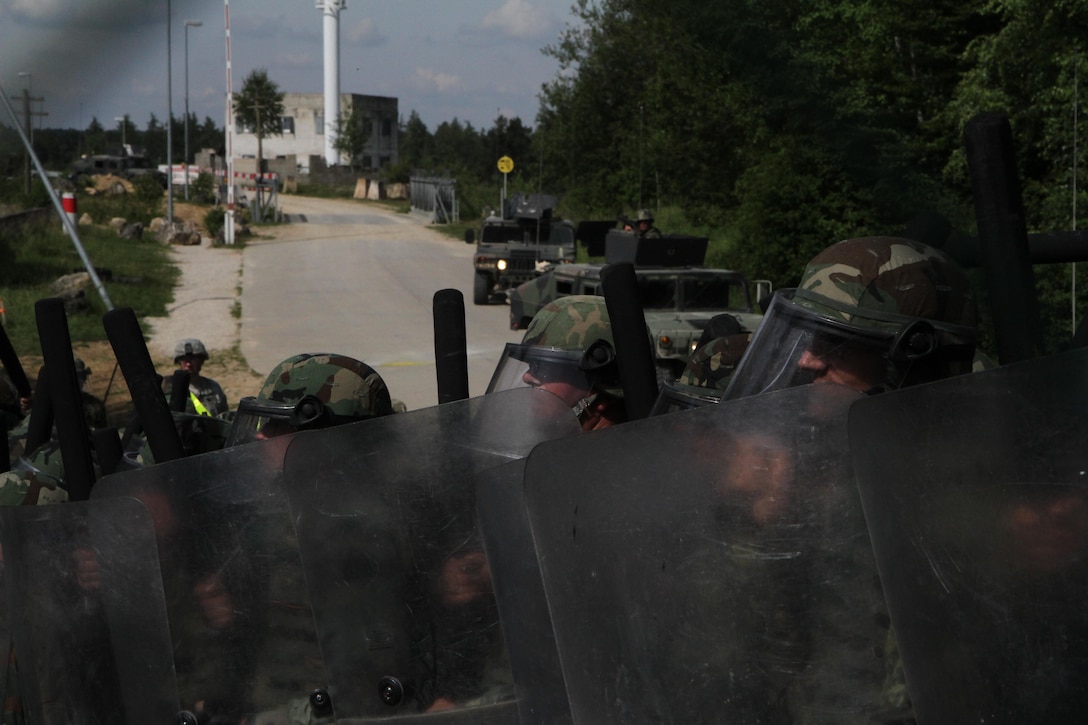 Troops from the Albanian Army take part in a multinational exercise that included forces from the U.S. and Moldova for crowd and riot control June 25 in Hohenfels, Germany. The 30th Armored Brigade Combat Team, an Army National Guard Unit from North Carolina, participated in this training event in preparation for a peacekeeping mission in Kosovo. (U.S. Army Photo by Sgt. Erick Yates)