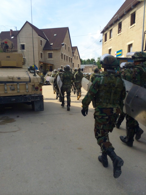 Soldiers from 1st Battalion, 252nd Armor Regiment’s Alpha Company take part in a multinational exercise with Moldovan armed forces for crowd and riot control in Hohenfels, Germany, June 25, 2015. The 30th Armored Brigade Combat Team, an Army National Guard Unit from North Carolina, participated in this event in preparation for a Kosovo Force (KFOR) peacekeeping mission designed to prepare the unit for peace support and stability along side their State Partnership country Moldova. (U.S. Army Photo by Sgt. Gina Russell/Released)