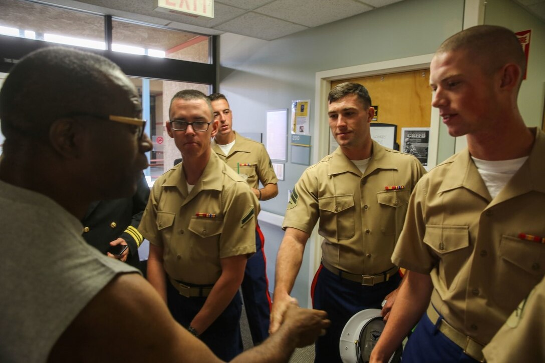 Marines and Sailors meet with Col. David D. Rabb while visiting the Veterans' Affairs Health Care System Hospital as part of San Francisco Fleet Week 2015, Oct. 6. Col. Rabb, U.S. Army Reserves, is the commanding officer of the 113th Medical Detachment, Combat Stress Control Unit, where soldiers with combat operational stress are treated. SFFW '15 is a week-long event that blends a unique training and education program, bringing together key civilian emergency responders and Naval crisis-response forces to exchange best practices focused on humanitarian assistance disaster relief with particular emphasis on defense support to civil authorities.