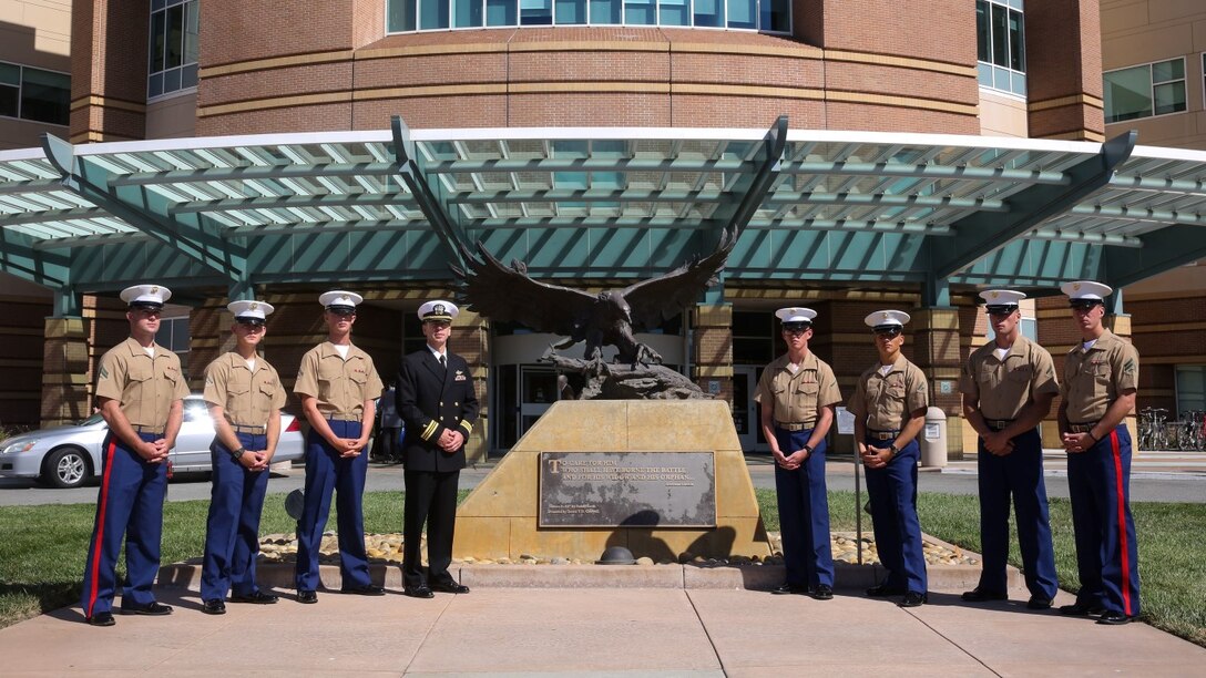 Marines and Sailors pose for a photo in front of the Veterans' Affairs Health Care System Hospital before visiting patients as part of San Francisco Fleet Week 2015, Oct 6. SFFW '15 is a week-long event that blends a unique training and education program, bringing together key civilian emergency responders and Naval crisis-response forces to exchange best practices focused on humanitarian assistance disaster relief with particular emphasis on defense support to civil authorities.