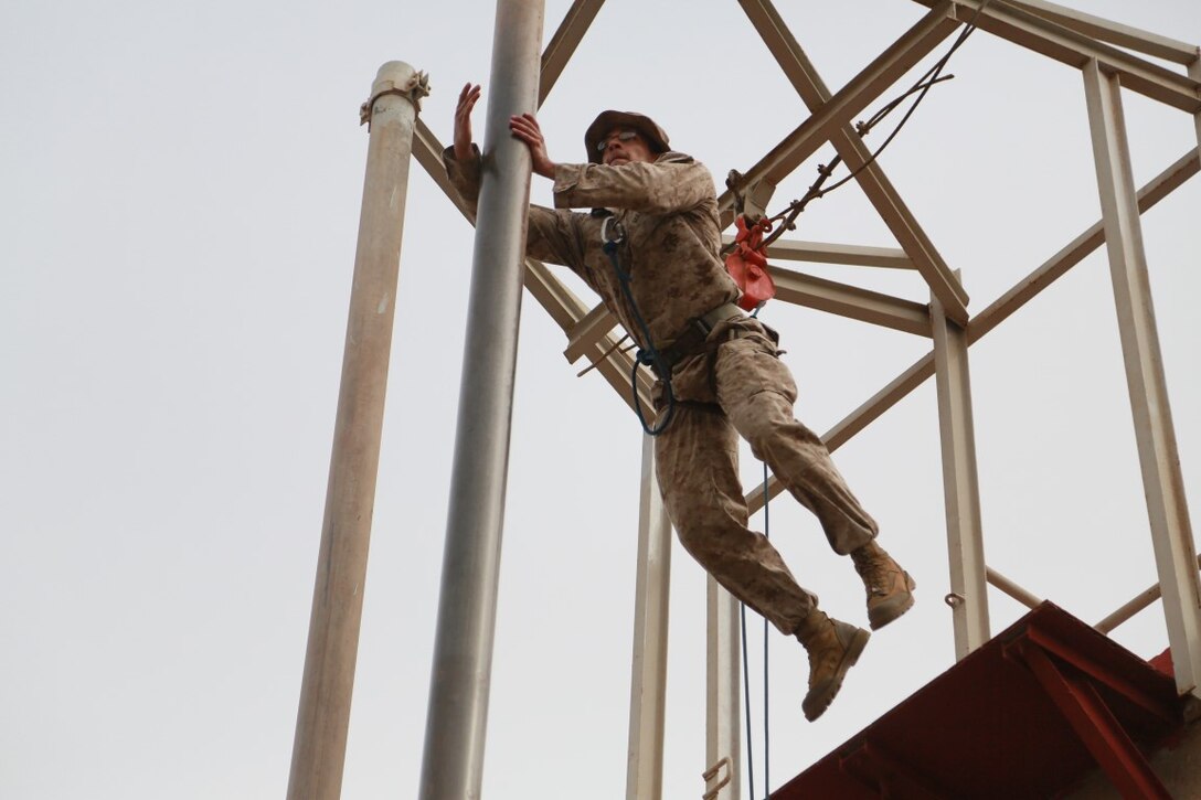 U.S. Marine Cpl. Michael Odintz jumps to an obstacle during a portion of a desert survival course with the French 5th Overseas Combined Arms Regiment (RIAOM). Odintz is a scout with Delta Company, 1st Light Armored Reconnaissance Detachment, Battalion Landing Team 3rd Battalion, 1st Marine Regiment, 15th Marine Expeditionary Unit. Elements of the 15th MEU are training with the 5th RIAOM in Djibouti in order to improve interoperability between the MEU and the French military. (U.S. Marine Corps photo by Sgt. Steve H. Lopez/Released)