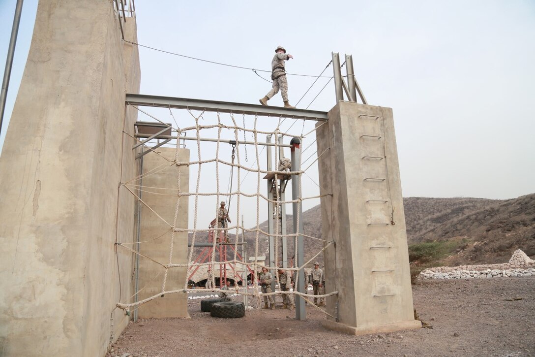 U.S. Marines from the 15th Marine Expeditionary Unit navigate obstacles during a portion of a desert survival course with the French 5th Overseas Combined Arms Regiment (RIAOM). Elements of the 15th MEU are training with the 5th RIAOM in Djibouti in order to improve interoperability between the MEU and the French military. (U.S. Marine Corps photo by Sgt. Steve H. Lopez/Released)