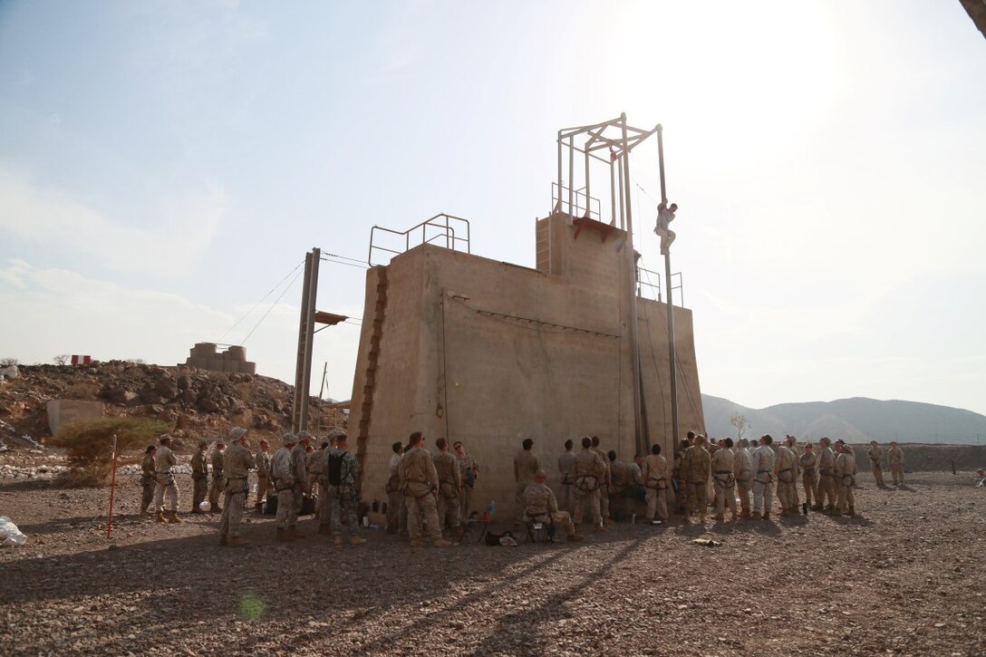 ARTA BEACH, Djibouti (Sept. 25, 2015) U.S. Marines with the 15th Marine Expeditionary Unit practice climbing techniques during a desert survival course alongside the French 5th Overseas Combined Arms Regiment (RIAOM). Elements of the 15th MEU are training with the 5th RIAOM in Djibouti in order to improve interoperability between the MEU and the French military. (U.S. Marine Corps photo by Sgt. Steve H. Lopez/Released)