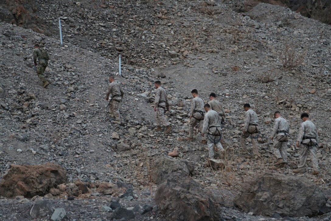 ARTA BEACH, Djibouti (Sept. 27, 2015) U.S. Marines with the 15th Marine Expeditionary Unit walk to the first obstacle during a desert survival course with the French 5th Overseas Combined Arms Regiment (RIAOM). Elements of the 15th MEU are training with the 5th RIAOM in Djibouti in order to improve interoperability between the MEU and the French military. (U.S. Marine Corps photo by Sgt. Steve H. Lopez/Released)