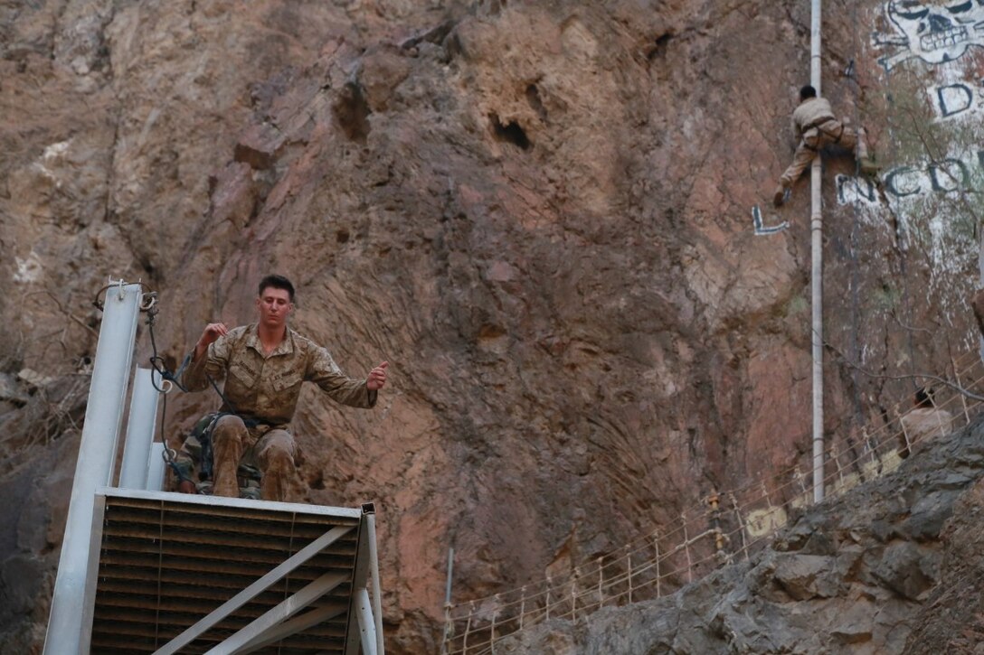 ARTA BEACH, Djibouti (Sept. 27, 2015) U.S. Marines with the 15th Marine Expeditionary Unit work through obstacles during a desert survival course alongside the French 5th Overseas Combined Arms Regiment (RIAOM). Elements of the 15th MEU are training with the 5th RIAOM in Djibouti in order to improve interoperability between the MEU and the French military. (U.S. Marine Corps photo by Sgt. Steve H. Lopez/Released)