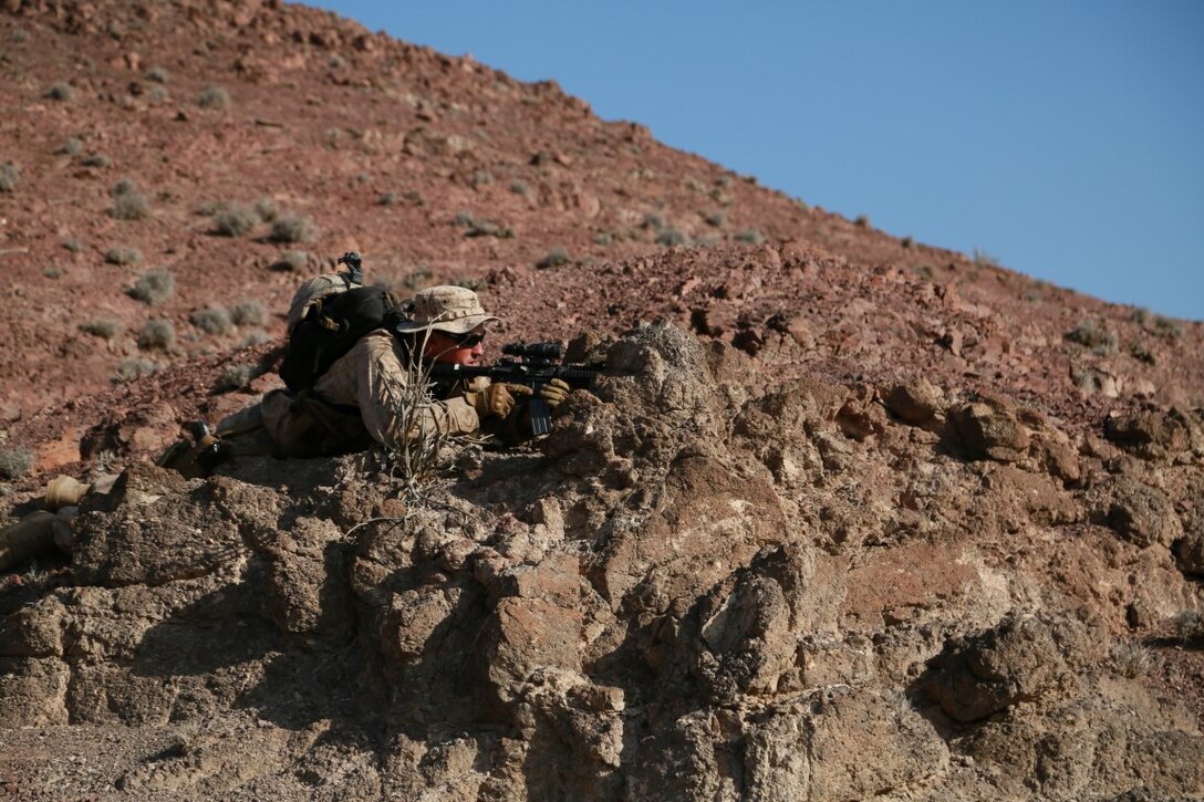 ARTA BEACH, Djibouti (Sept. 29, 2015) U.S. Marine 1st Lt. Michael Hosteny provides security for his squad during a patrolling exercise during a desert survival course with the French 5th Overseas Combined Arms Regiment (RIAOM). Hosteny is the executive officer of Delta Company, 1st Light Armored Reconnaissance Detachment, Battalion Landing Team 3rd Battalion, 1st Marine Regiment, 15th Marine Expeditionary Unit. Elements of the 15th MEU are training with the 5th RIAOM in Djibouti in order to improve interoperability between the MEU and the French military. (U.S. Marine Corps photo by Sgt. Steve H. Lopez/Released)