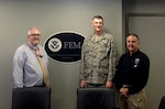 (From left) Federal Emergency Management Agency Administrator Craig Fugate, Defense Logistics Agency Director Air Force Lt. Gen. Andy Busch and FEMA Deputy Administrator Joseph Nimmich meet June 12 at FEMA’s headquarters in Washington, D.C. Busch toured the agency’s 24/7 National Response Coordination Center, the focal point for national disaster coordination, where he learned firsthand about the support DLA provides to FEMA. 